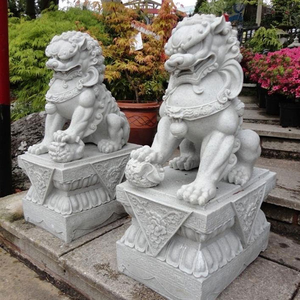 Outdoor white marble foo dogs in pairs in the front of porch for sale